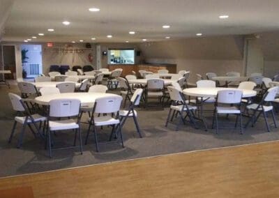 Alternate view of function room with tables and chairs set up